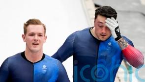 British pair Brad Hall and Nick Gleeson crash in two-man bobsleigh