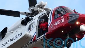 Helicopter and coastguard teams rescue man stuck on steep slope