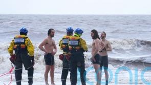Trio defy storm warnings to strip off for sea dip