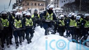 Canadian police clear parliament’s streets in bid to end siege