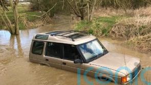 Family with baby rescued from roof of 4×4 stuck in floodwater