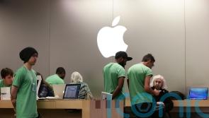 Armed suspect holds hostage at Amsterdam Apple Store