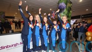 Triumphant Olympic curling teams land in Edinburgh