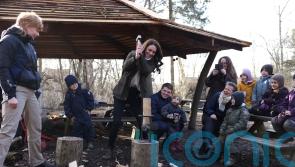 Kate wields hammer to chop wood on fact-finding mission to Danish forest school