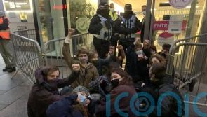 Extinction Rebellion activists interrupt black-tie dinner for oil and gas firms