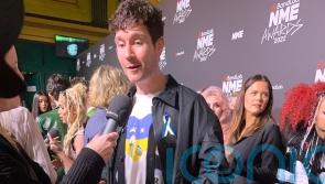 Bastille frontman Dan Smith wears colours of Ukrainian flag to NME Awards