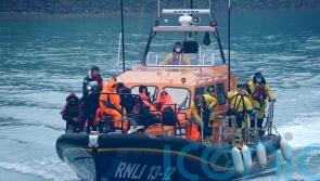 Migrants brought ashore by RNLI and Border Force after crossing Channel