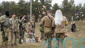 Ukrainian volunteer troops marry in military fatigues at Kyiv checkpoint