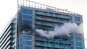 Fire breaks out at high-rise block of flats and offices in east London