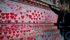 Covid-19 weekly deaths in England and Wales fall to half of Omicron peak