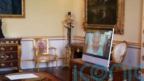 Smiling Queen holds virtual audiences at Windsor