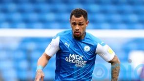Jonson Clarke-Harris’ late penalty earns Peterborough a point against Stoke