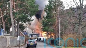 Hotel goes up in flames after blaze spreads from shed