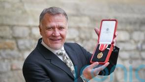 Partner receives knighthood on behalf of late opera director Sir Graham Vick