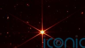 Space telescope’s image of star gets photobombed by galaxies