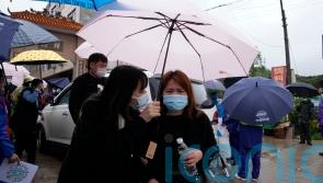 Search at China plane crash site suspended amid rain