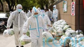 China tackles growing Covid outbreak with lockdown and testing in Shanghai