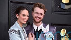 Finneas teases Grammys performance with sister Billie Eilish on red carpet
