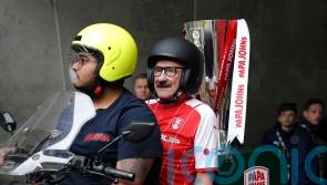 Paul Chuckle and Tim Vine deliver Wembley football trophy on takeaway bikes