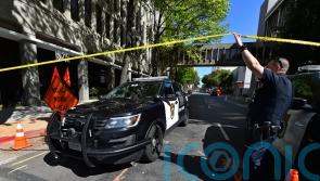 California police continue search for gunmen who killed six and hurt 12
