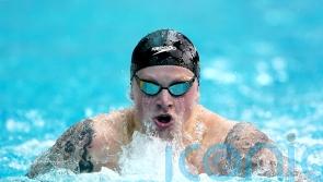 Adam Peaty hits form to retain British title