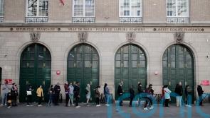 France goes to the polls as Macron faces strong challenge from Le Pen