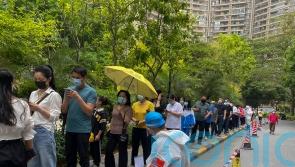 Chinese city of Guangzhou shuts schools in battle with Covid surge