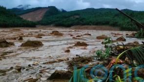 Rescuers look for missing people after deadly landslides in Philippines
