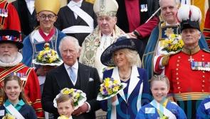 Charles gives out Maundy money in absence of Queen