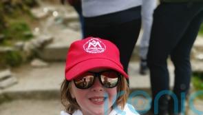 Six-year-old climbing height of Mount Kilimanjaro for spinal injuries charity