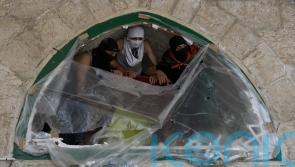 Dozens of Palestinians injured in tensions at mosque in Jerusalem
