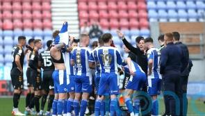Cambridge’s Mark Bonner backs Wigan to go up despite his side halting their run