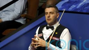 Mark Selby reaches Crucible second round with battling victory over Jamie Jones