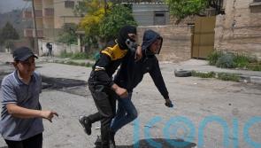 Palestinians protest over closures as settlers march in West Bank