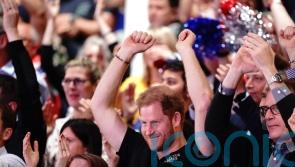 Harry joins Team UK fans in Invictus murderball showdown with Team US