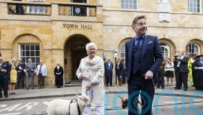 Dame Judi Dench and Sir Kenneth Branagh herd sheep after freeman ceremony