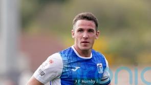 John Rooney fires 10-man Barrow to victory over play-off hopefuls Sutton
