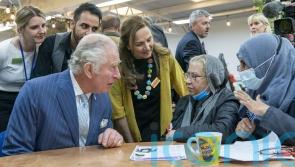 Charles expresses concern for asylum seekers during community centre visit