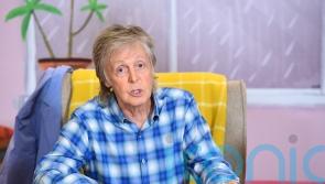 Sir Paul McCartney uses documentary footage for John Lennon duet in stage return