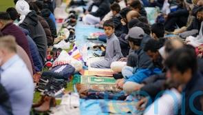 In Pictures: Communities gather in prayer to mark end of Ramadan