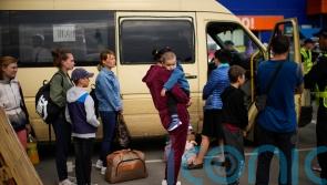 Aid workers prepare stretchers and toys for Mariupol evacuees
