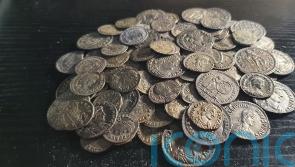 Detectorist friends find hoard of 161 Roman coins beneath their campsite