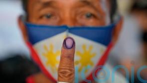 Philippines presidential race narrows to Marcos Jr and human rights lawyer