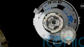Boeing docks crew capsule to space station for first time