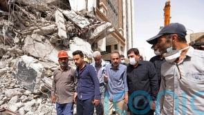 Iranian police disperse crowd gathered at collapsed building