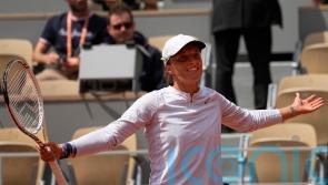 Iga Swiatek survives second-set scare to progress in French Open