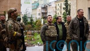 Russians storm city and shell east Ukraine as Zelensky visits Kharkiv region