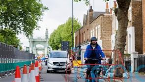 Cyclists wear car frames to show ‘absurdity’ of vehicles hogging roads