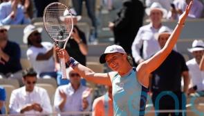 Iga Swiatek eases into French Open final after getting fired up by Led Zeppelin