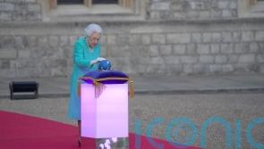 Delighted Queen leads Jubilee celebrations at beacon lighting and on balcony